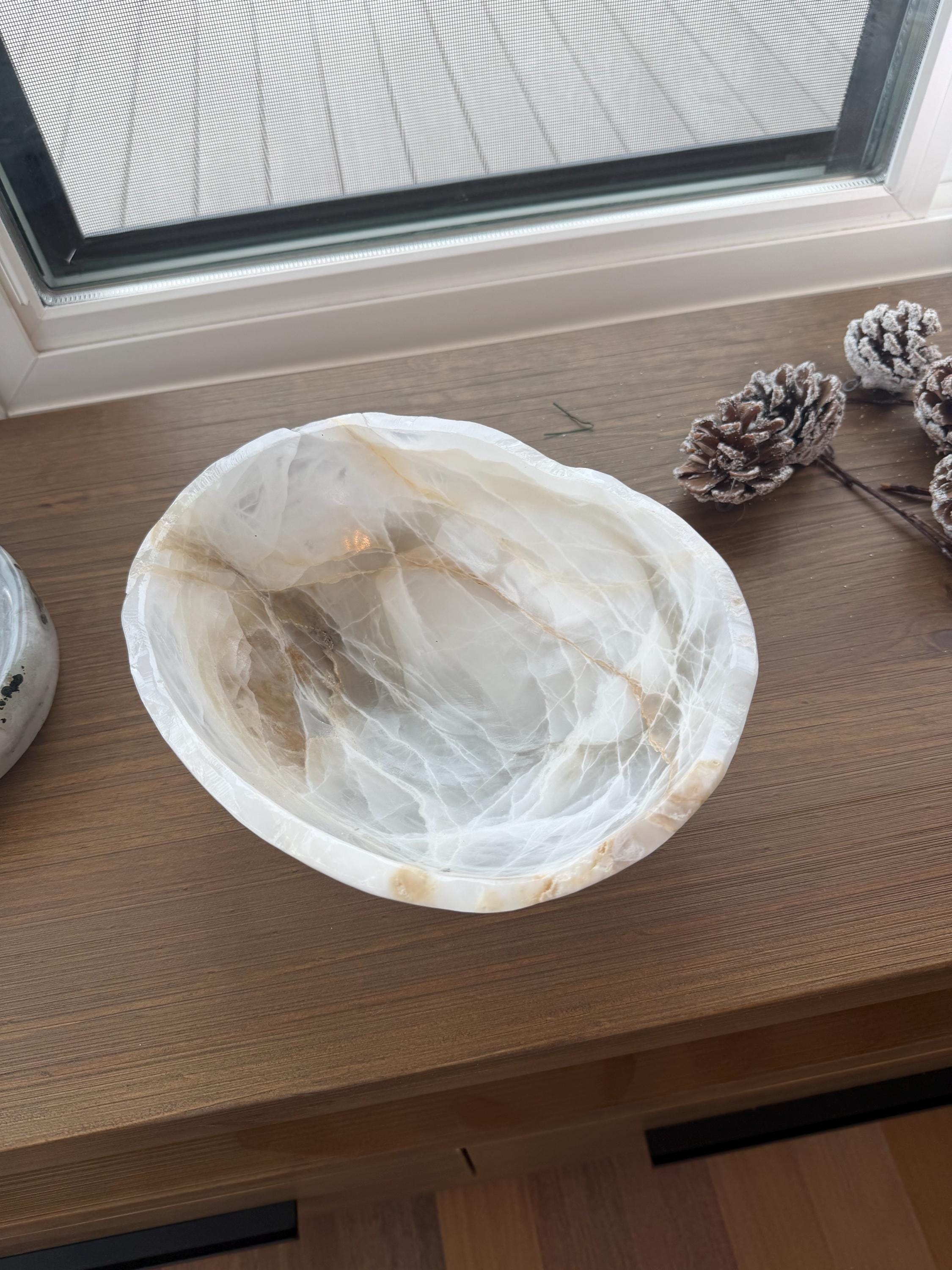 One of a kind pearlescent decorative onyx bowls.